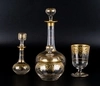 Два графина, вазочка с крышкой и бокал c золоченым декором. <br>Западная Европа, конец ХIХ века.