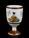 Шесть стопок для сакэ с изображением национальных типажей. Япония, вторая треть ХХ века.