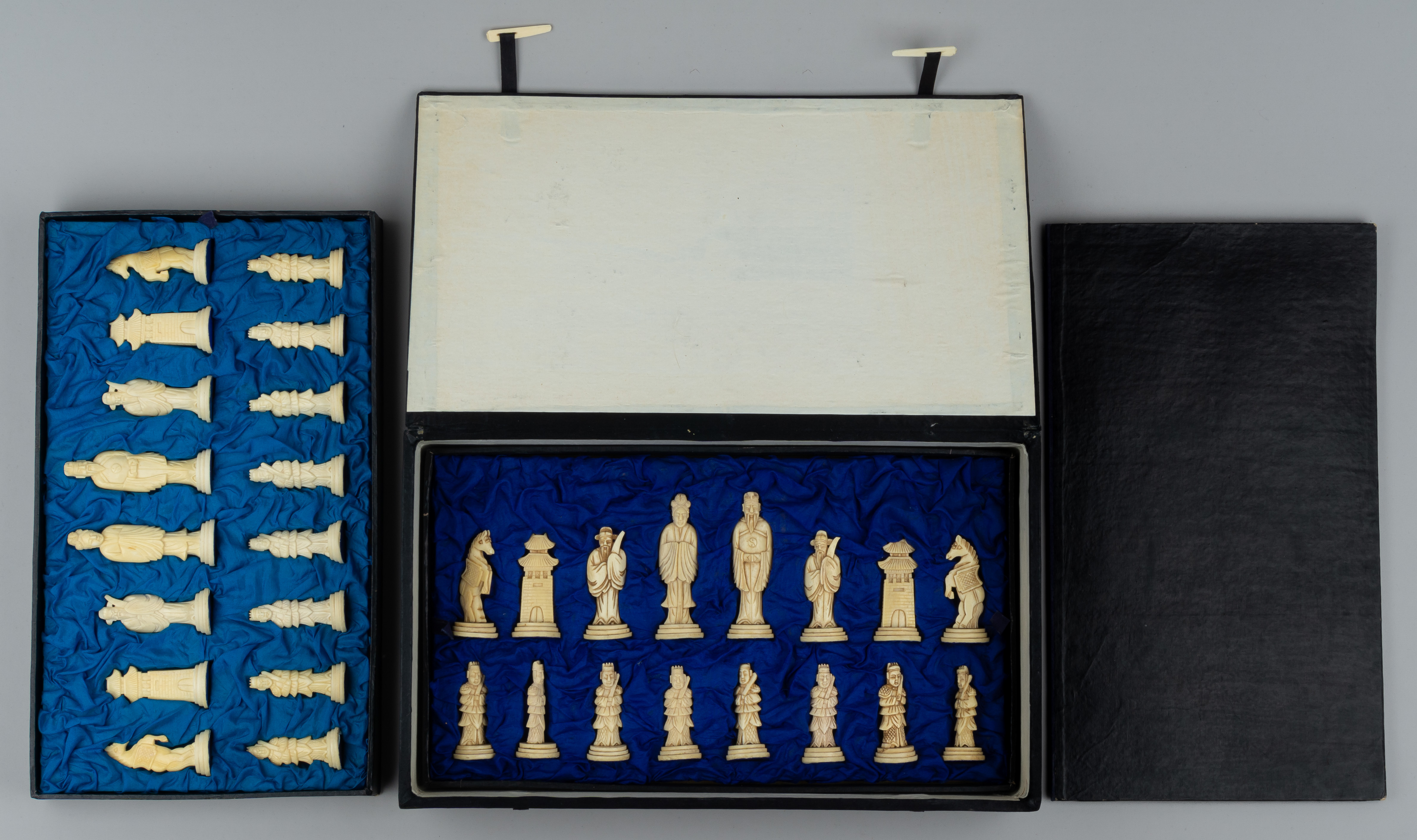 Шахматы из кости с национальными типажами.<br>Китай, середина ХХ века.