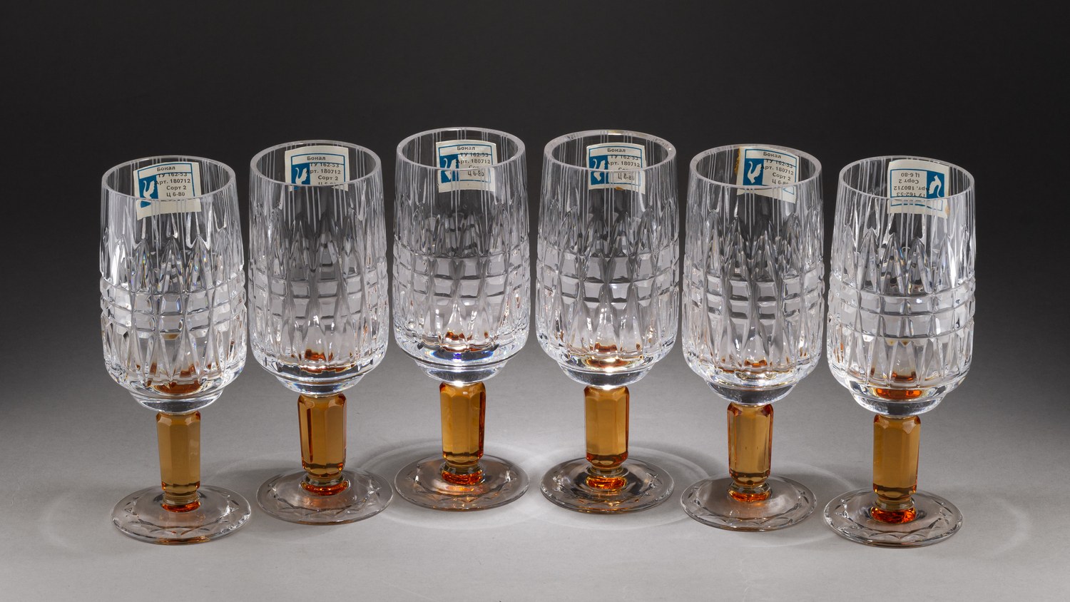 (С фирменной биркой) Шесть бокалов «Олимпиада 80». СССР, Гусь-Хрустальный, дизайнер - Станислав Верин, 1973-1980. В заводской упаковке.