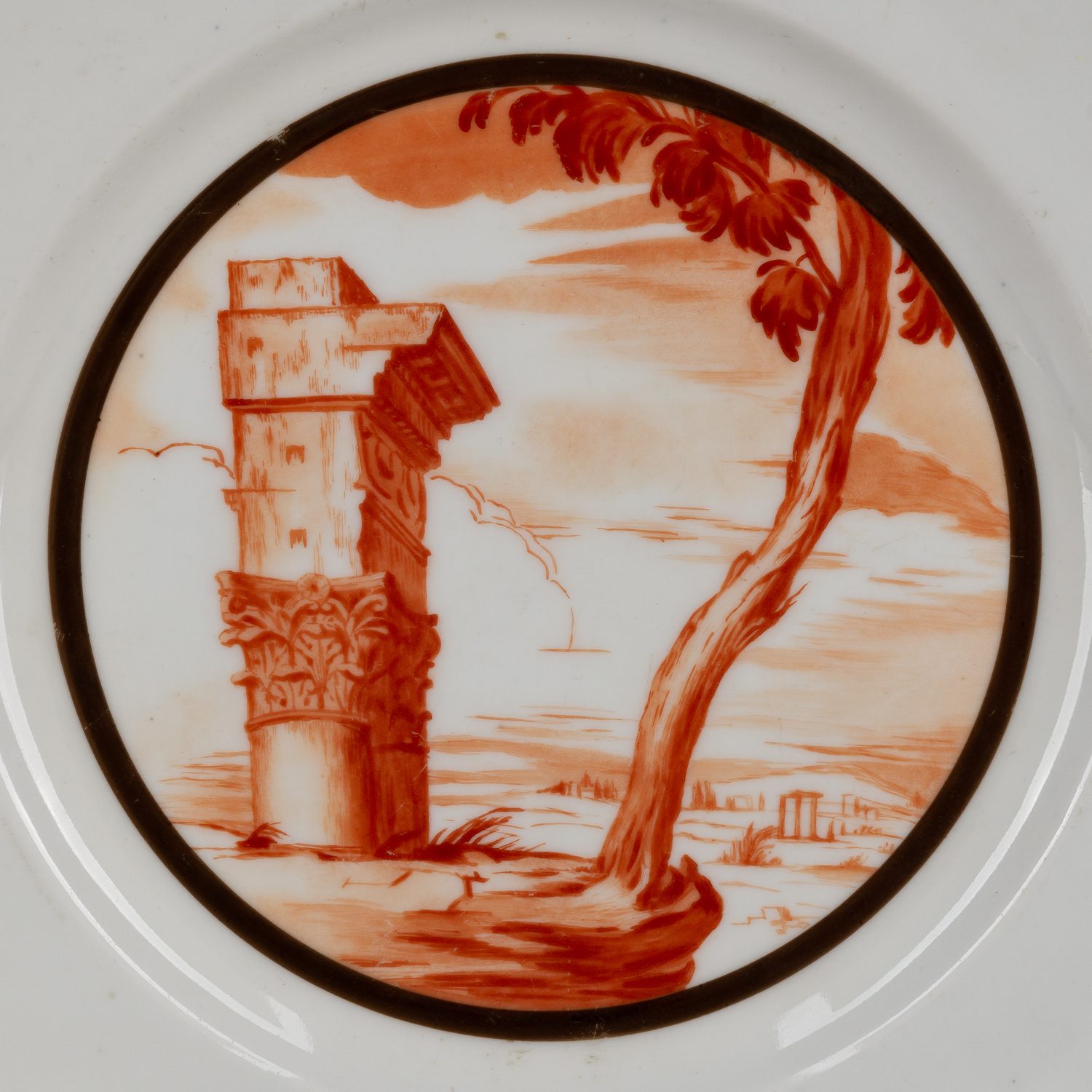 (М.М. Адамович) Тарелка с изображением античного пейзажа с руинами. Государственный фарфоровый завод, автор росписи М.М. Адамович, художник по фарфору Н.С. Благовещенская-Васильянова 1919.
