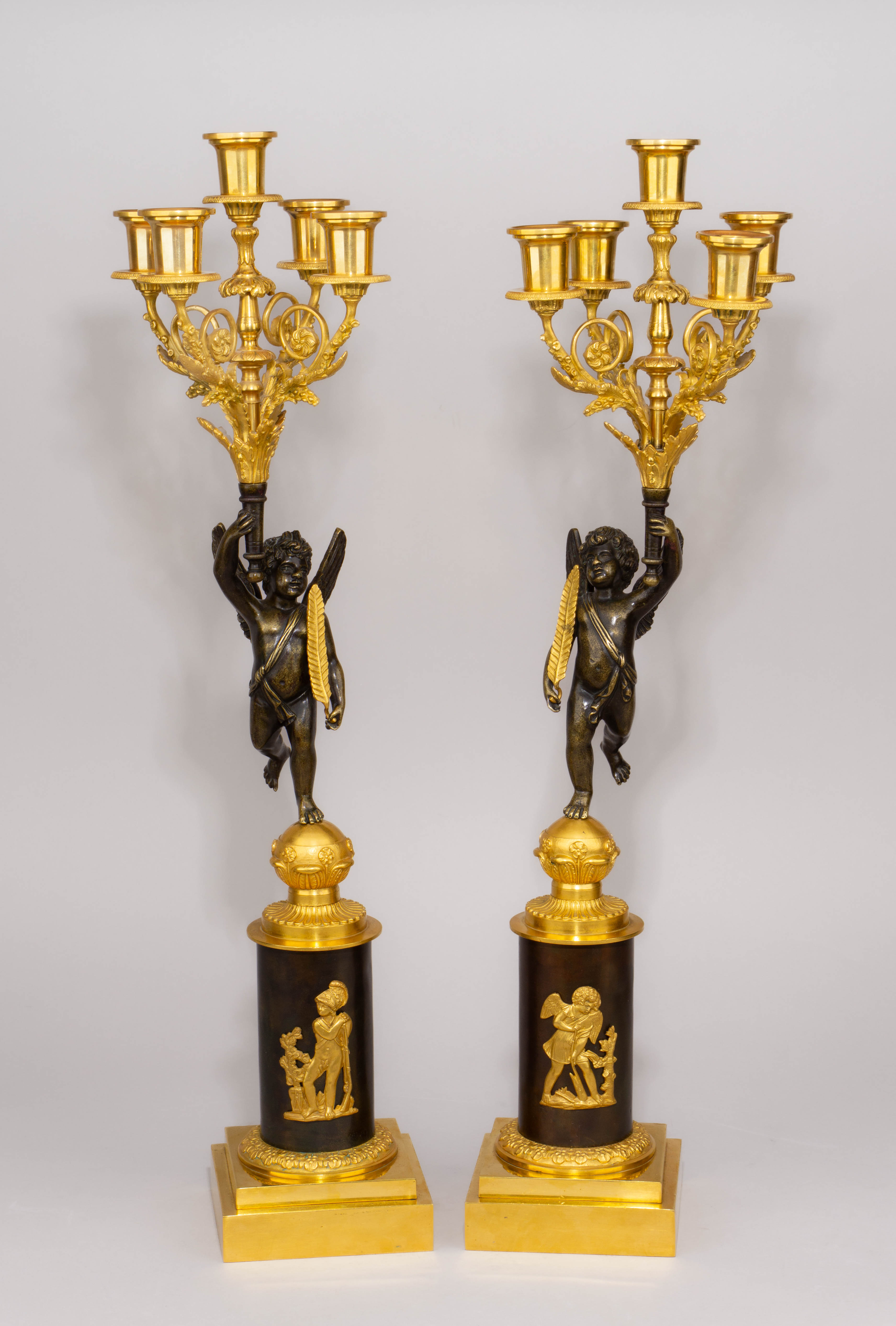 Парные канделябры на пять свечей с фигурами летящего мальчика-зефира. Россия. 1820-е годы