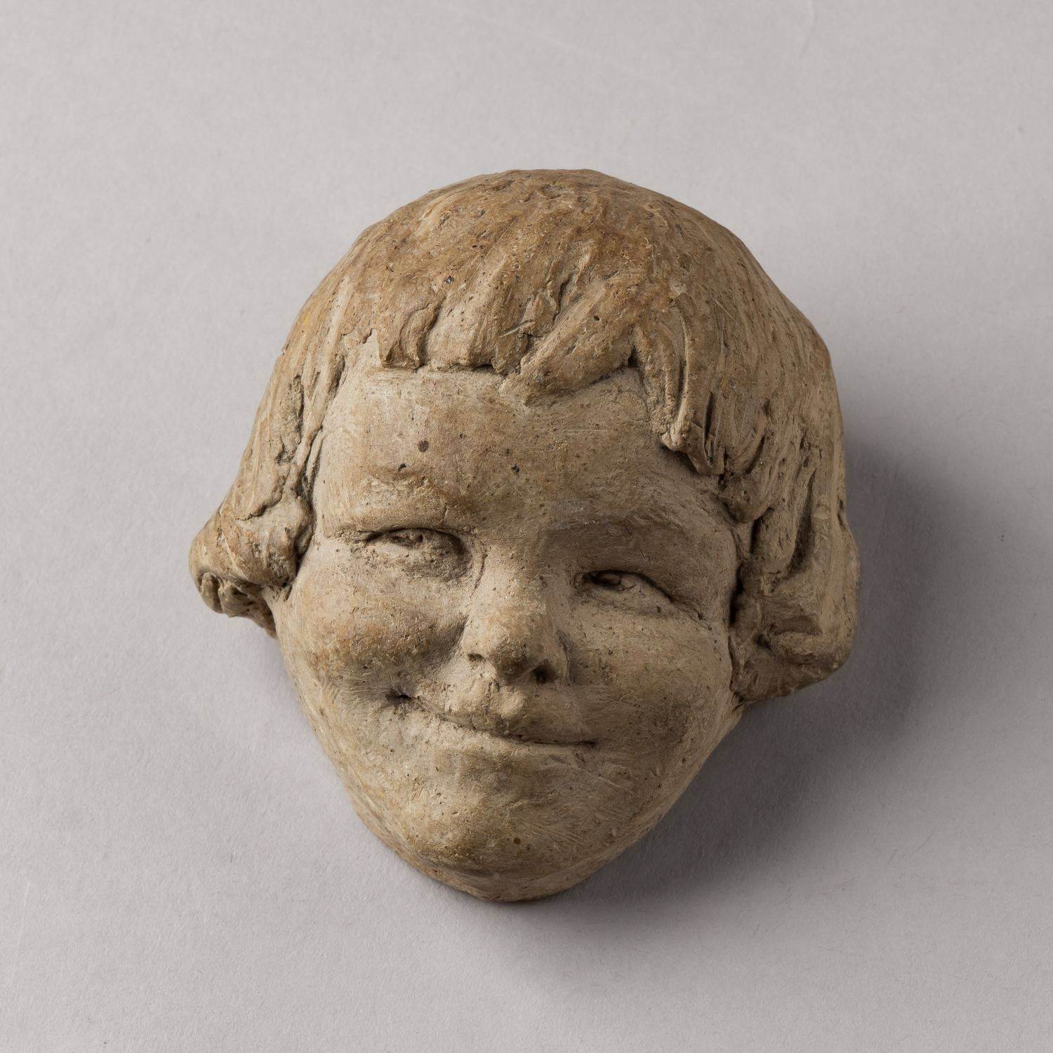 (Иннокентий  Жуков)  Скульптура «Голова улыбающегося ребенка». СССР, скульптор И.Н. Жуков, 1928.